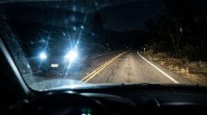 Headlight glare accident claims in 2026 involving bright LED headlights at night.